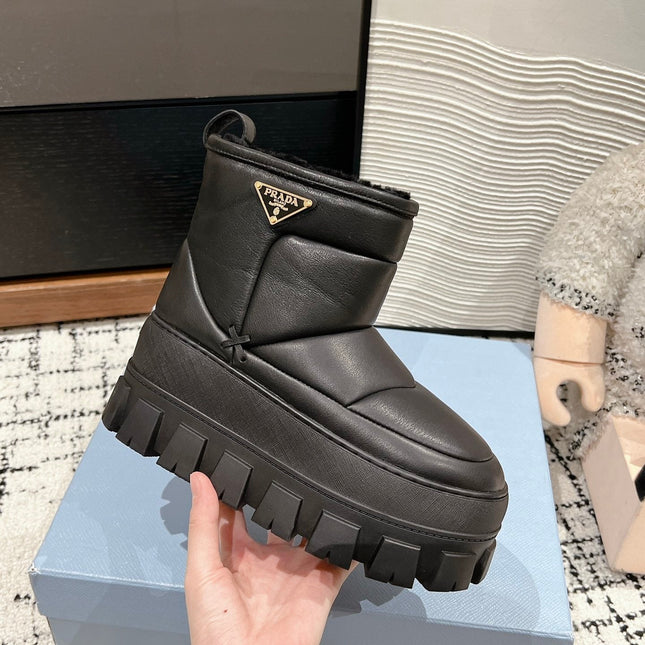 MONOLITH ANKLE BOOTS IN BLACK CALFSKIN AND LAMB FUR LINING