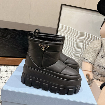 MONOLITH ANKLE BOOTS IN BLACK CALFSKIN AND LAMB FUR LINING