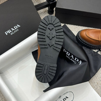 PRADA 25S LOAFER 50MM IN BURNT ORANGE CALFSKIN LOGO
