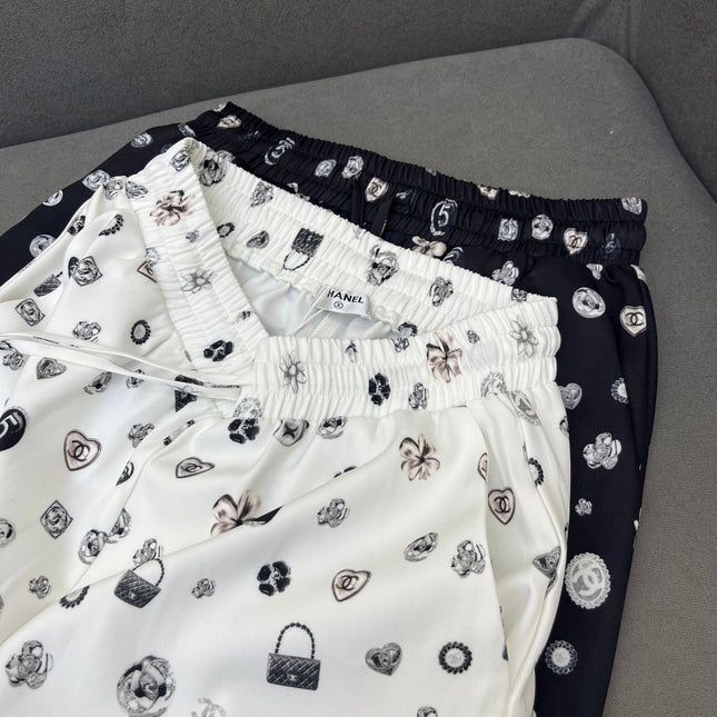 ALL-OVER LOGO PRINTED PANTS WITH STRETCH WAIST