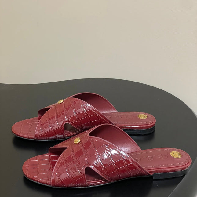 FLAT SLIPPERS IN RED CALFSKIN SNAKE EMBOSSING