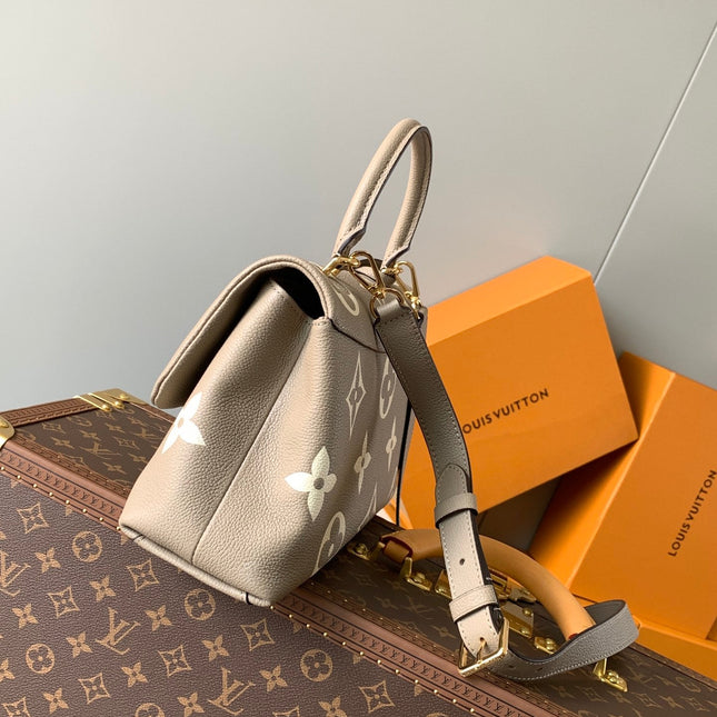 MADELEINE 30 IN BEIGE MONOGRAM CALFSKIN EMBOSSED LOGO