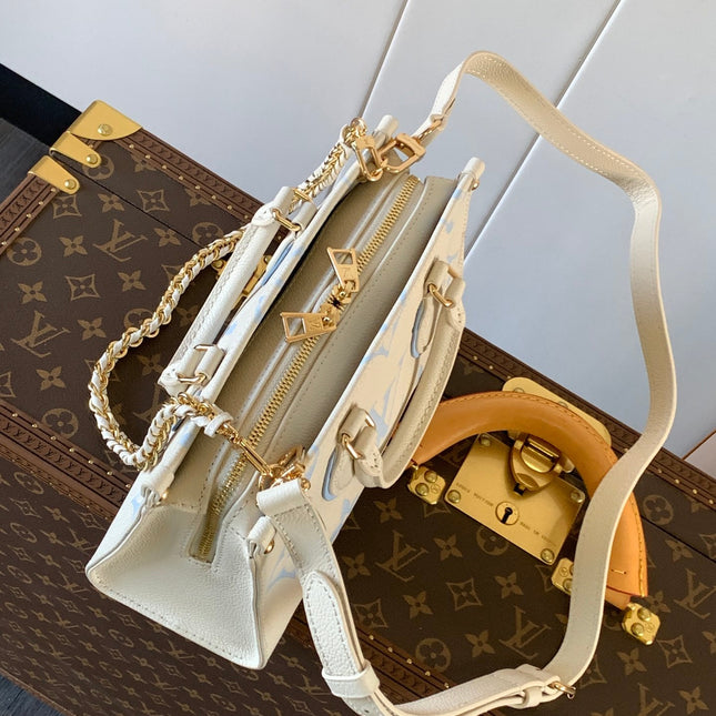 LV 25S ONTHEGO EAST WEST BAG 25 IN WHITE BLUE CALFSKIN MONOGRAM EMPREINTE