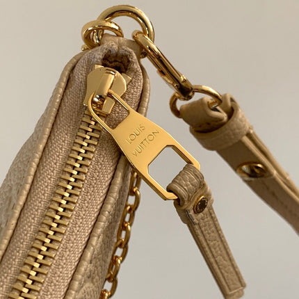 EASY POUCH ON STRAP 19 IN BEIGE MONOGRAM EMPREINTE LEATHER