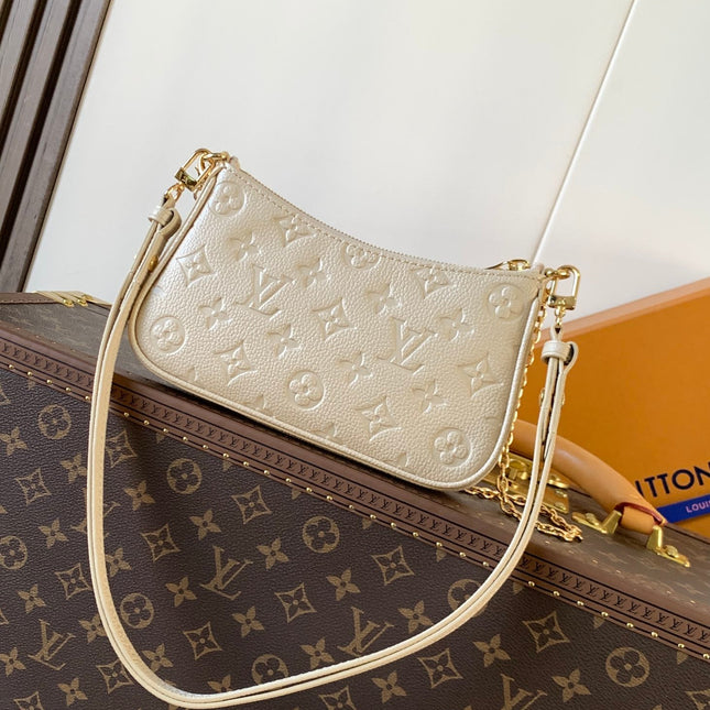 EASY POUCH ON STRAP 19 IN BEIGE MONOGRAM EMPREINTE LEATHER