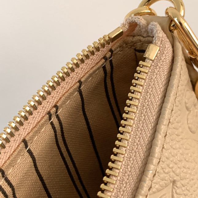 EASY POUCH ON STRAP 19 IN BEIGE MONOGRAM EMPREINTE LEATHER