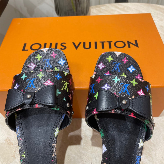 BOW FLAT MULES IN BLACK MONOGRAM LAMBSKIN
