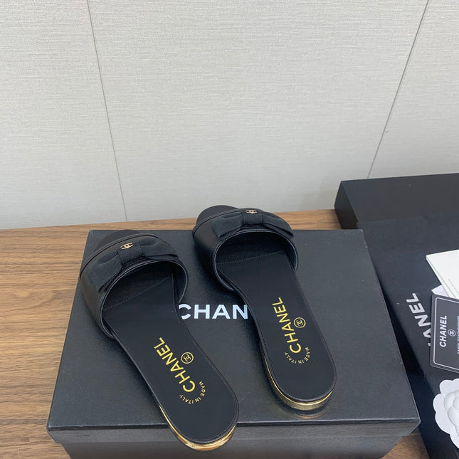 BOW SLIPPERS IN BLACK LAMBSKIN