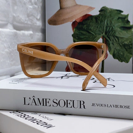 TRIOMPHE SUNGLASSES 552774 IN CARAMEL ACETATE TEXT LOGO