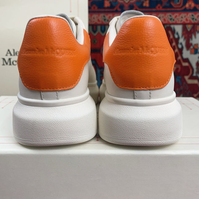 OVERSIZED SNEAKER IN WHITE CALFSKIN ORANGE HEEL TAB EMBOSSED LOGO
