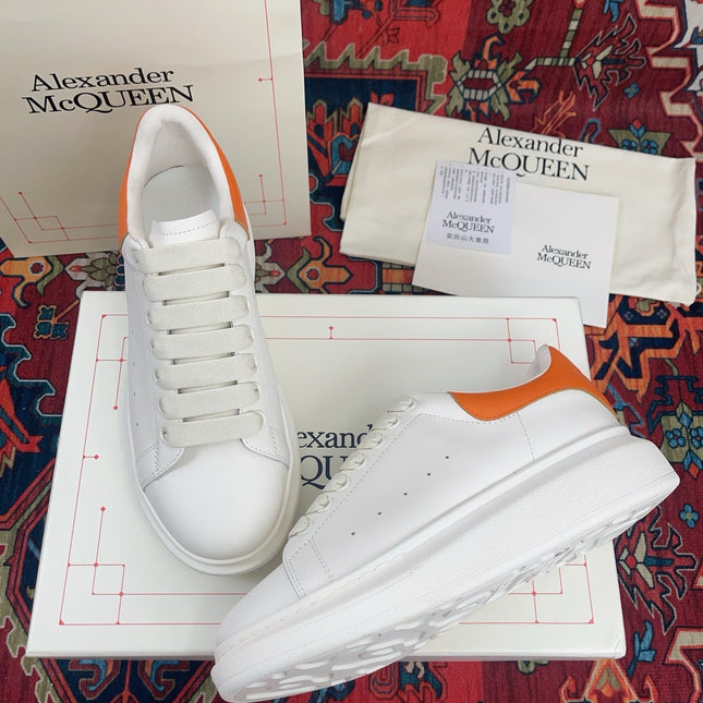 OVERSIZED SNEAKER IN WHITE CALFSKIN ORANGE HEEL TAB EMBOSSED LOGO