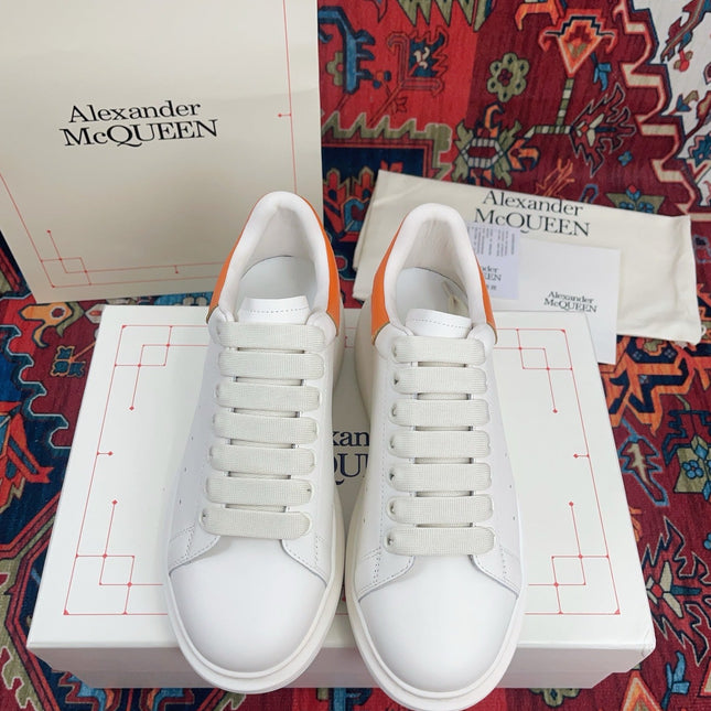 OVERSIZED SNEAKER IN WHITE CALFSKIN ORANGE HEEL TAB EMBOSSED LOGO