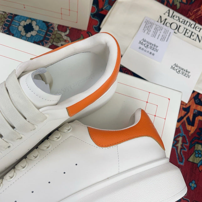 OVERSIZED SNEAKER IN WHITE CALFSKIN ORANGE HEEL TAB EMBOSSED LOGO