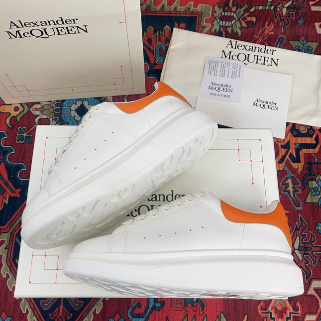 OVERSIZED SNEAKER IN WHITE CALFSKIN ORANGE HEEL TAB EMBOSSED LOGO