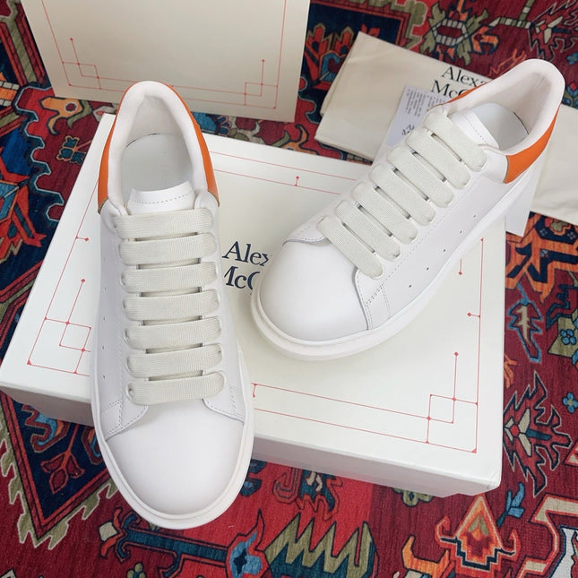 OVERSIZED SNEAKER IN WHITE CALFSKIN ORANGE HEEL TAB EMBOSSED LOGO