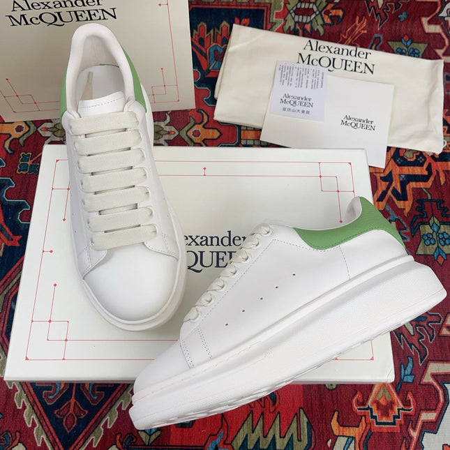 OVERSIZED SNEAKER IN WHITE CALFSKIN WITH EMBOSSED HUNTER GREEN HEEL TAB