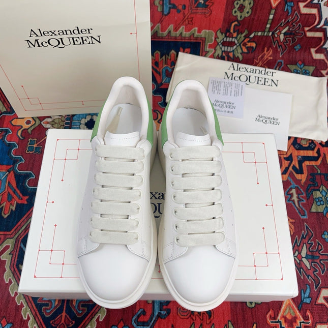 OVERSIZED SNEAKER IN WHITE CALFSKIN WITH EMBOSSED HUNTER GREEN HEEL TAB