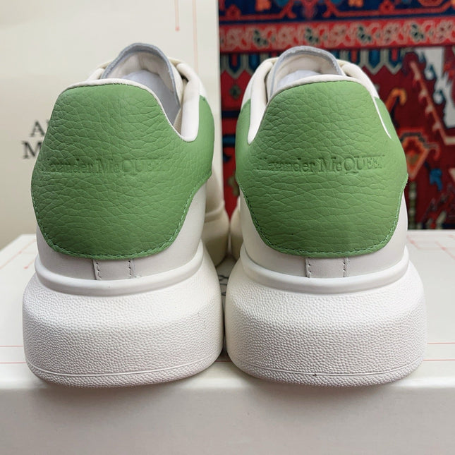 OVERSIZED SNEAKER IN WHITE CALFSKIN WITH EMBOSSED HUNTER GREEN HEEL TAB