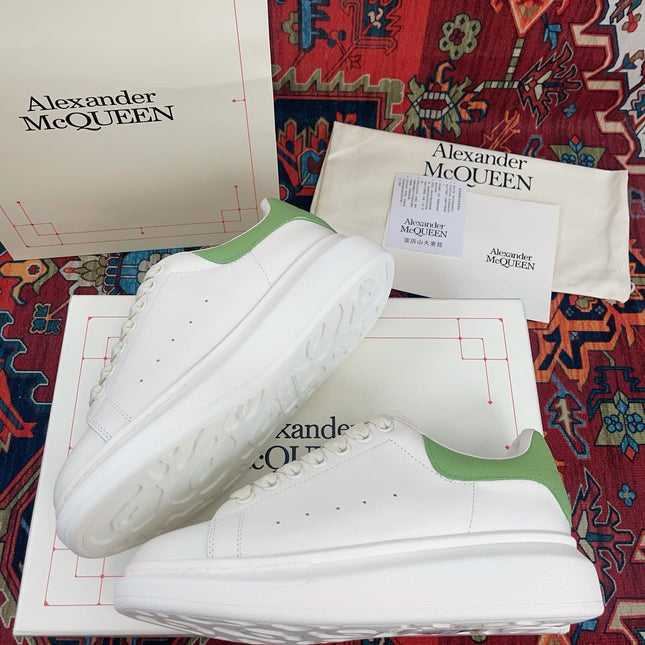 OVERSIZED SNEAKER IN WHITE CALFSKIN WITH EMBOSSED HUNTER GREEN HEEL TAB