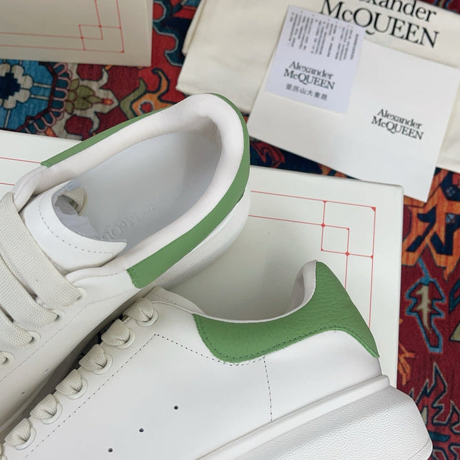 OVERSIZED SNEAKER IN WHITE CALFSKIN WITH EMBOSSED HUNTER GREEN HEEL TAB
