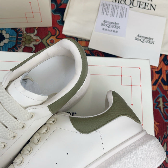 OVERSIZED SNEAKER IN WHITE CALFSKIN WITH EMBOSSED OLIVE GREEN HEEL TAB