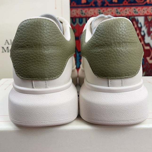 OVERSIZED SNEAKER IN WHITE CALFSKIN WITH EMBOSSED OLIVE GREEN HEEL TAB