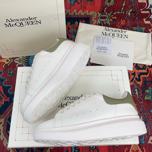 OVERSIZED SNEAKER IN WHITE CALFSKIN WITH EMBOSSED OLIVE GREEN HEEL TAB