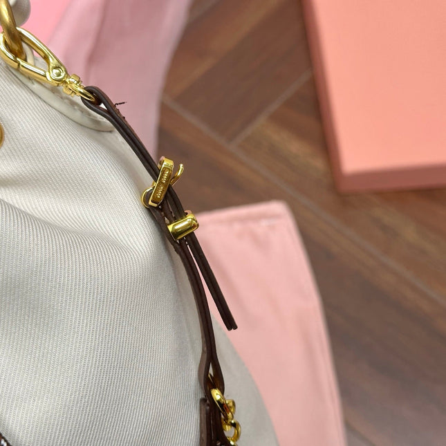 DRAWSTRING BUCKET BAG 21 IN WHITE CANVAS GOLD HARDWARE