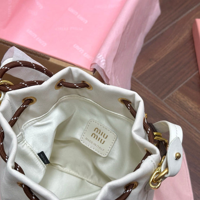 DRAWSTRING BUCKET BAG 21 IN WHITE CANVAS GOLD HARDWARE