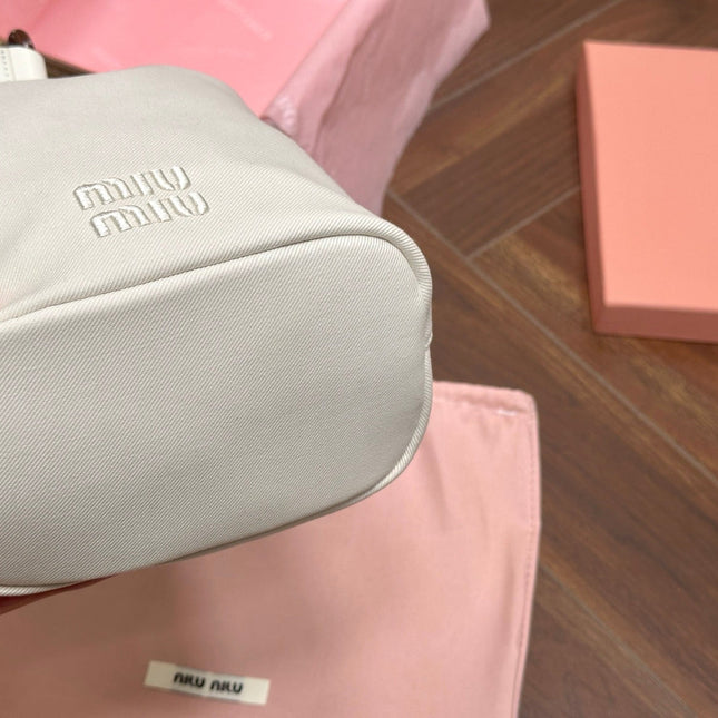 DRAWSTRING BUCKET BAG 21 IN WHITE CANVAS GOLD HARDWARE