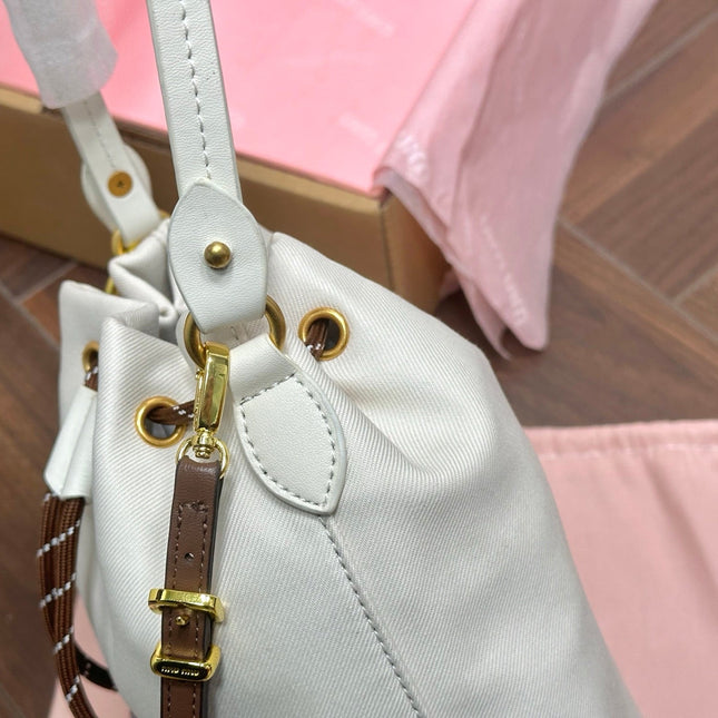 DRAWSTRING BUCKET BAG 21 IN WHITE CANVAS GOLD HARDWARE