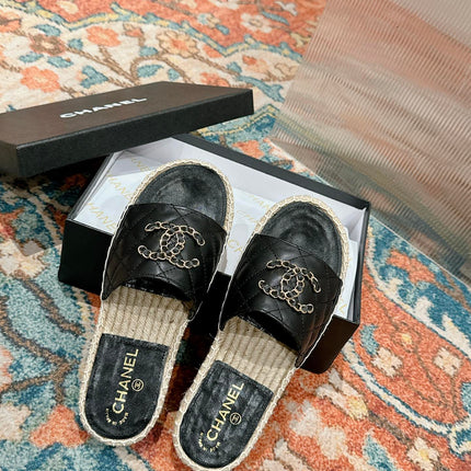 FLAT SLIPPERS IN BLACK LAMBSKIN AND WOVEN WITH LOGO