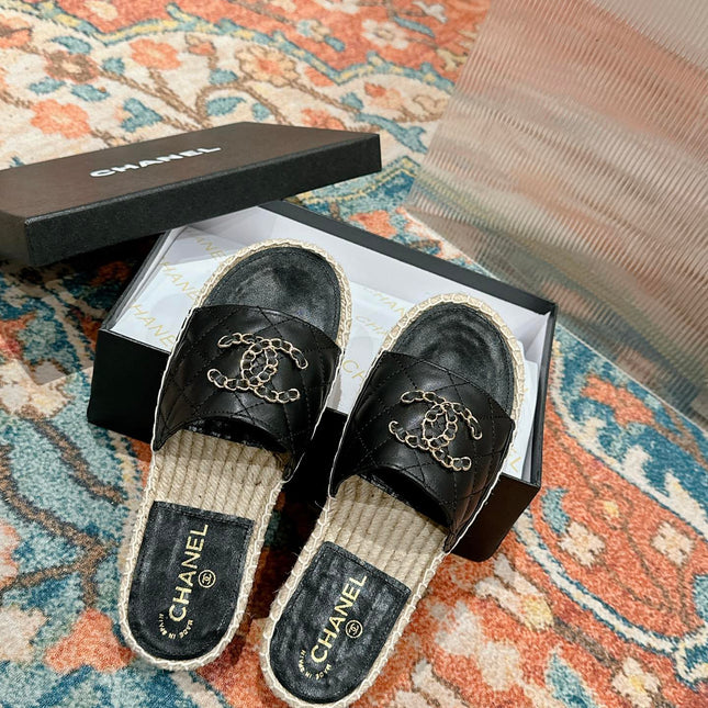 FLAT SLIPPERS IN BLACK LAMBSKIN AND WOVEN WITH LOGO