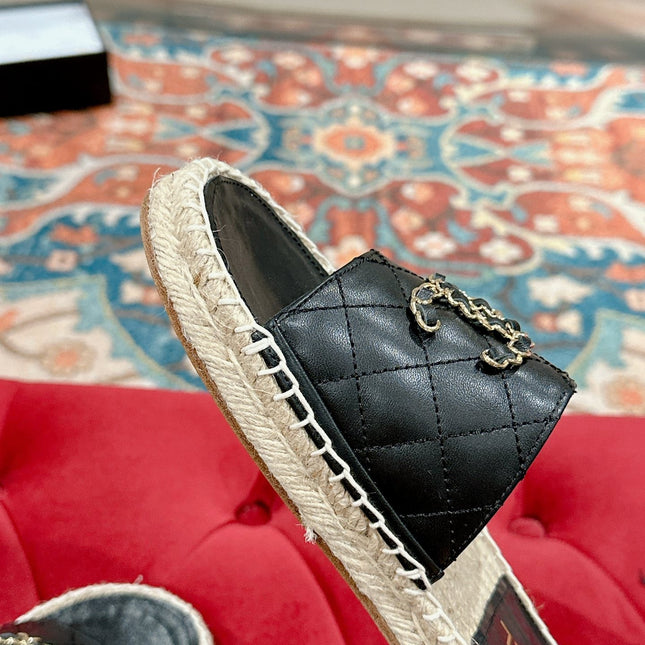 FLAT SLIPPERS IN BLACK LAMBSKIN AND WOVEN WITH LOGO