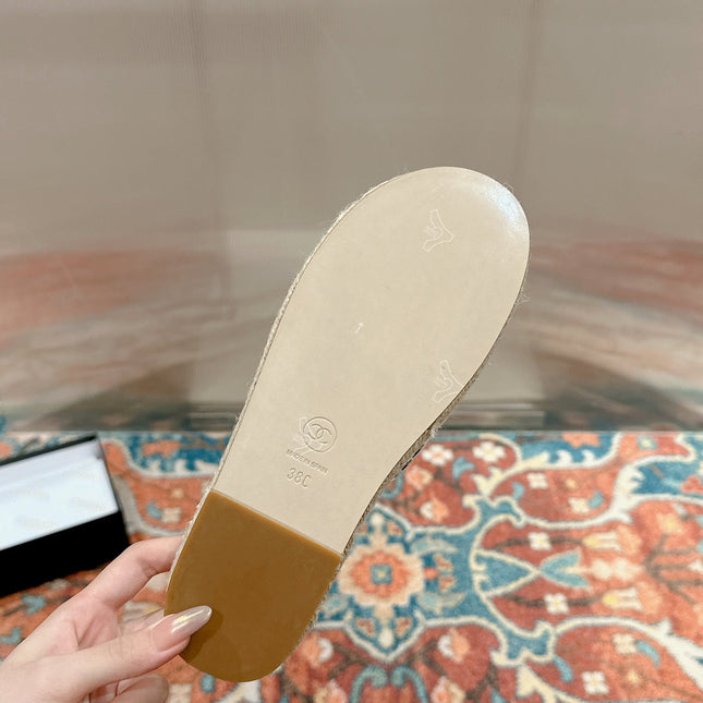 FLAT SLIPPERS IN BLACK LAMBSKIN AND WOVEN WITH LOGO