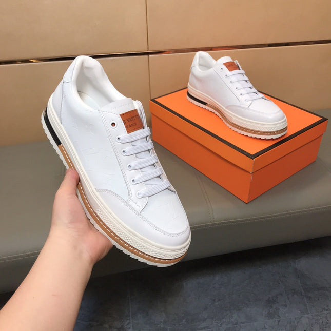 LV TRAINER IN EMBOSSED WHITE SUEDE