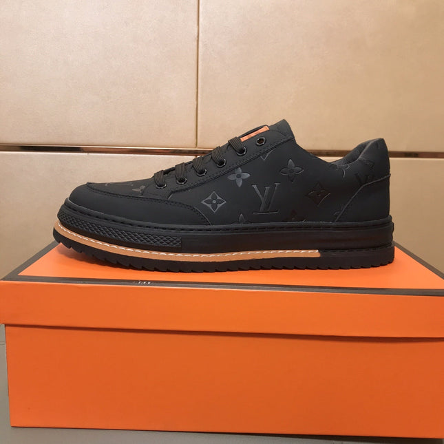 LV TRAINER IN EMBOSSED BLACK SUEDE