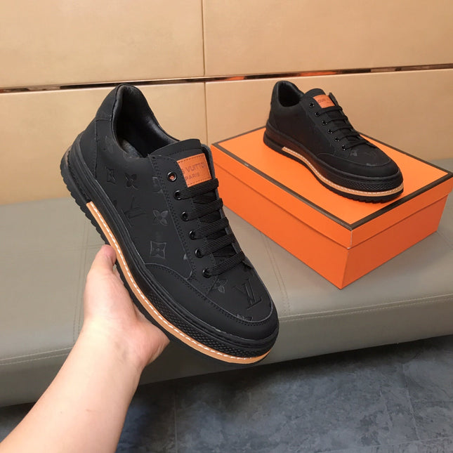 LV TRAINER IN EMBOSSED BLACK SUEDE