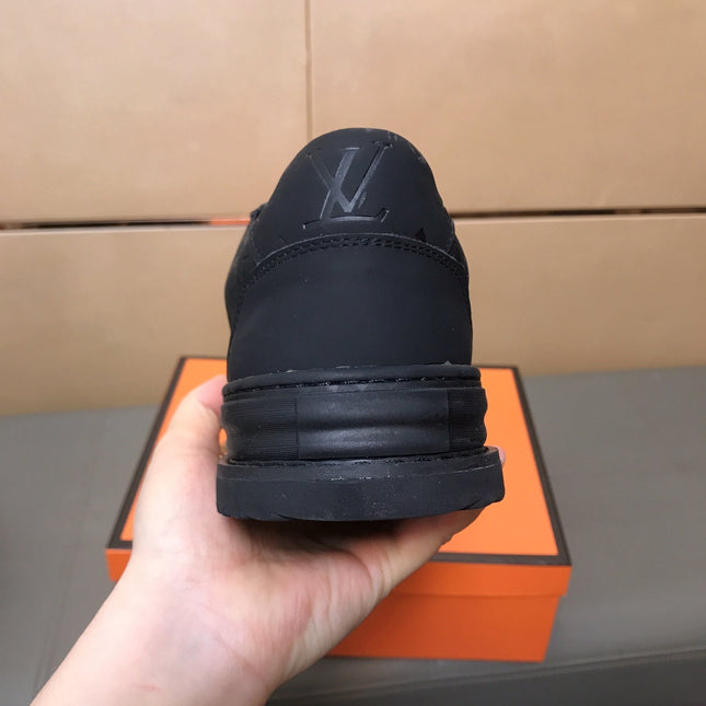 LV TRAINER IN EMBOSSED BLACK SUEDE
