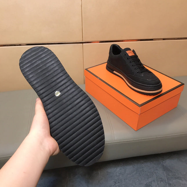 LV TRAINER IN EMBOSSED BLACK SUEDE
