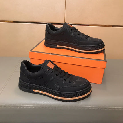 LV TRAINER IN EMBOSSED BLACK SUEDE