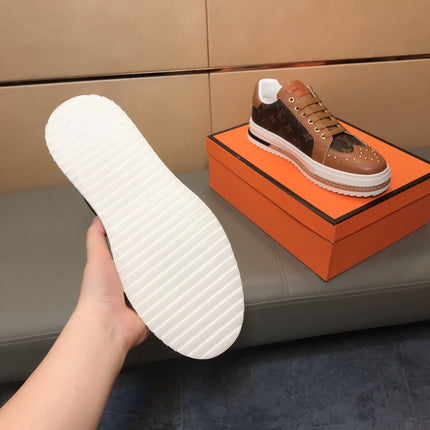LV TRAINER IN BROWN MONOGRAM CALFSKIN