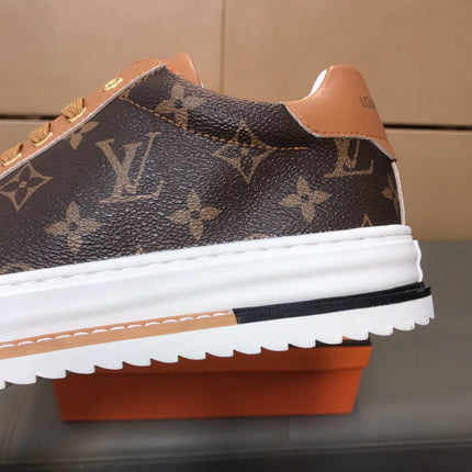 LV TRAINER IN BROWN MONOGRAM CALFSKIN