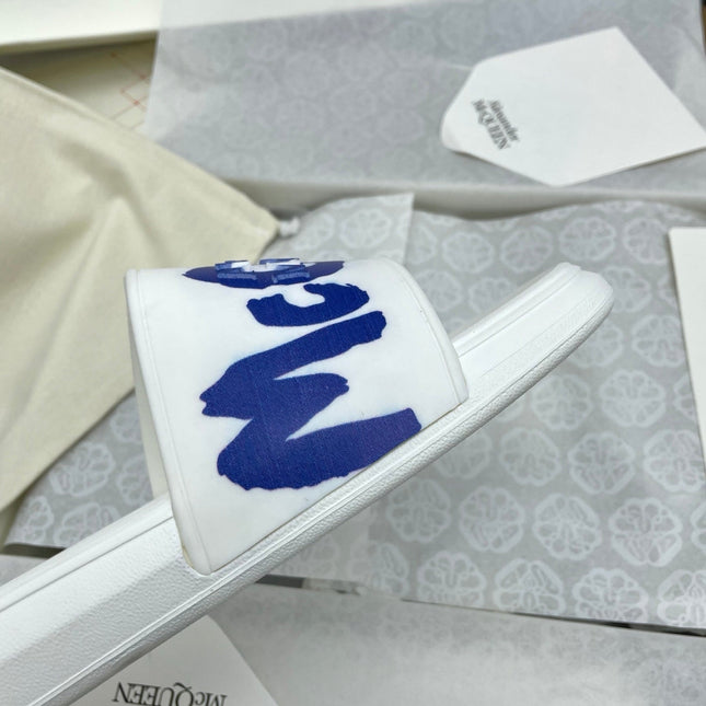 SLIDES SANDAL IN WHITE WITH BLUE LOGO GRAPHIC IN STRAP