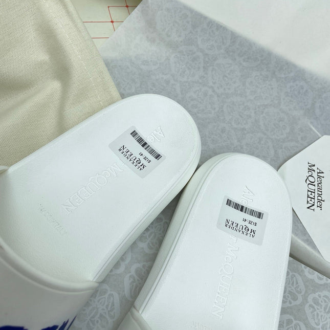 SLIDES SANDAL IN WHITE WITH BLUE LOGO GRAPHIC IN STRAP