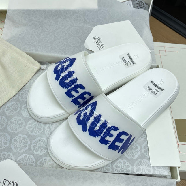 SLIDES SANDAL IN WHITE WITH BLUE LOGO GRAPHIC IN STRAP