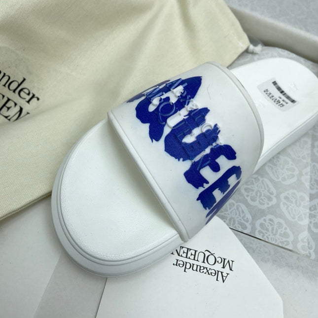 SLIDES SANDAL IN WHITE WITH BLUE LOGO GRAPHIC IN STRAP