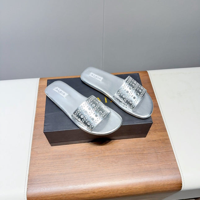 ALAIA FLAT SANDALS WITH PERFORATED STRAPS 25S IN SILVER LAMBSKIN