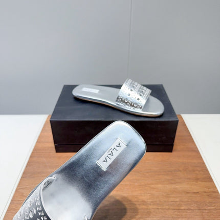 ALAIA FLAT SANDALS WITH PERFORATED STRAPS 25S IN SILVER LAMBSKIN