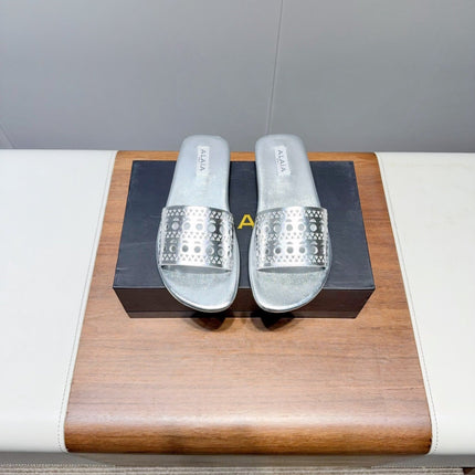 ALAIA FLAT SANDALS WITH PERFORATED STRAPS 25S IN SILVER LAMBSKIN